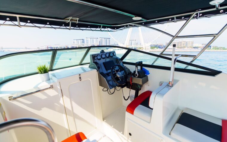 Helm and cockpit under the hardtop on the 31ft mini-yacht