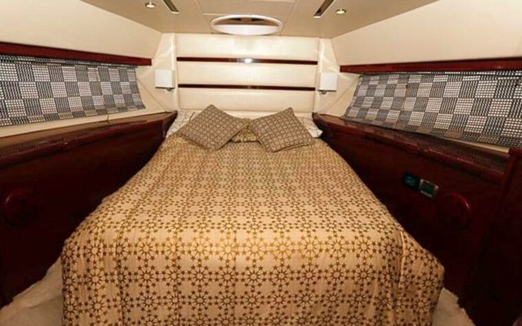 Master cabin with a double bed aboard the 50ft private yacht