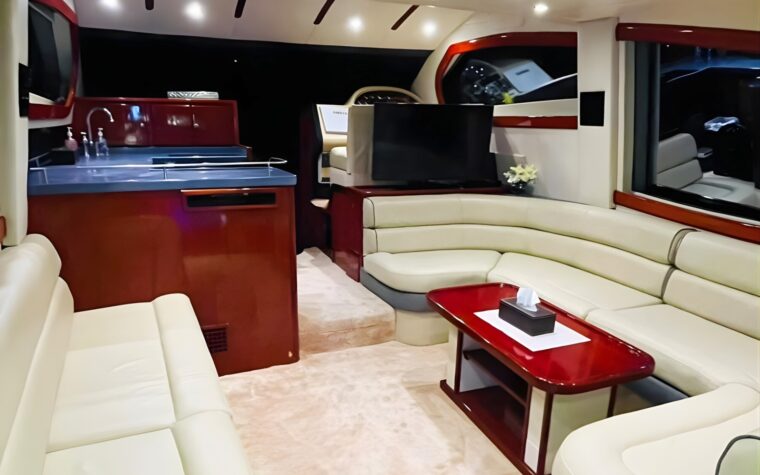 Saloon galley with refrigerator and television aboard the 50ft yacht