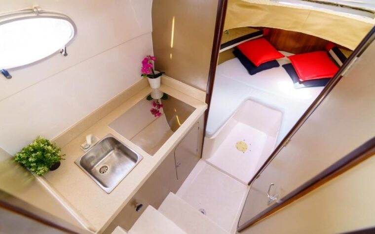 Cabin with a berth and basin below deck on the fishing boat