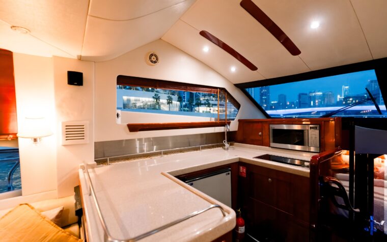 Galley with refrigerator and microwave aboard the dinner cruise yacht