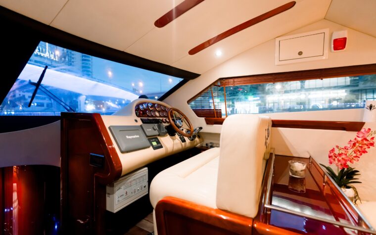 Lower helm station beside the saloon seating aboard the 50ft yacht