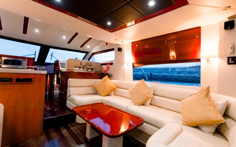 Cream leather seating around the saloon dining table aboard the 50ft yacht