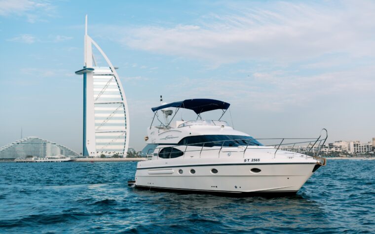 Sea King 50ft yacht on the water with the Burj Al Arab behind, Dubai