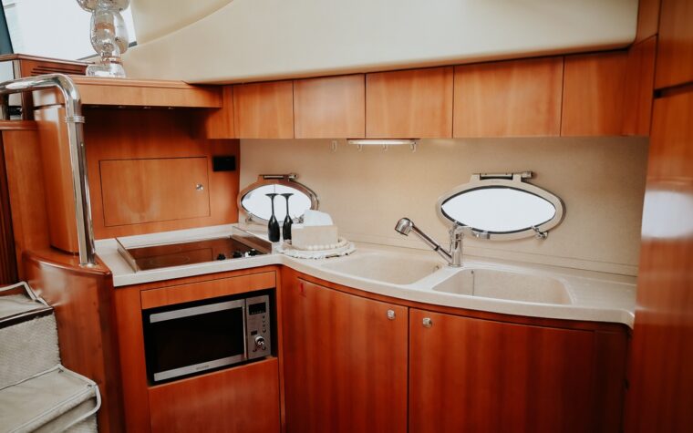 Galley with a microwave, sink and storage aboard the 46ft yacht